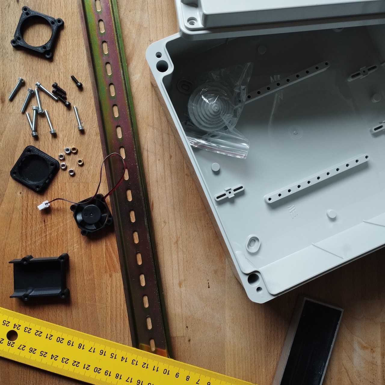 Close-up of the DIN rail, enclosure, ventilation parts