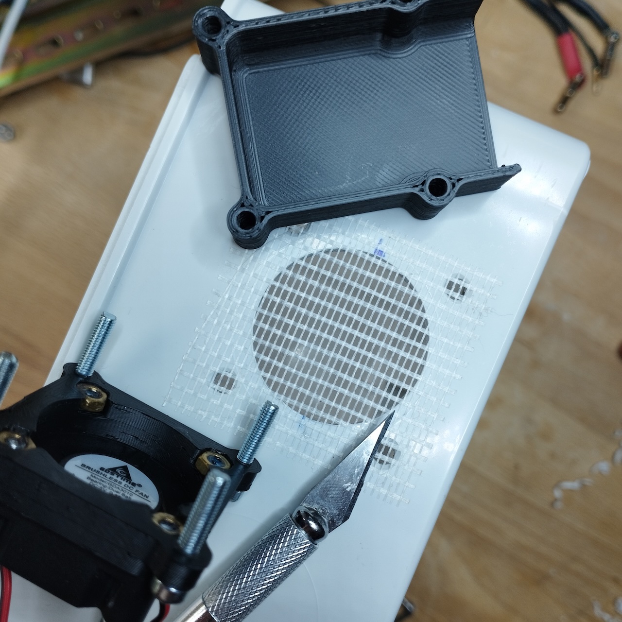 3D-printed ventilation grille test-fitted in the cutout